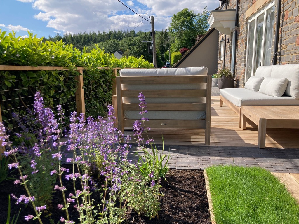 Outdoor furniture in a hillside garden