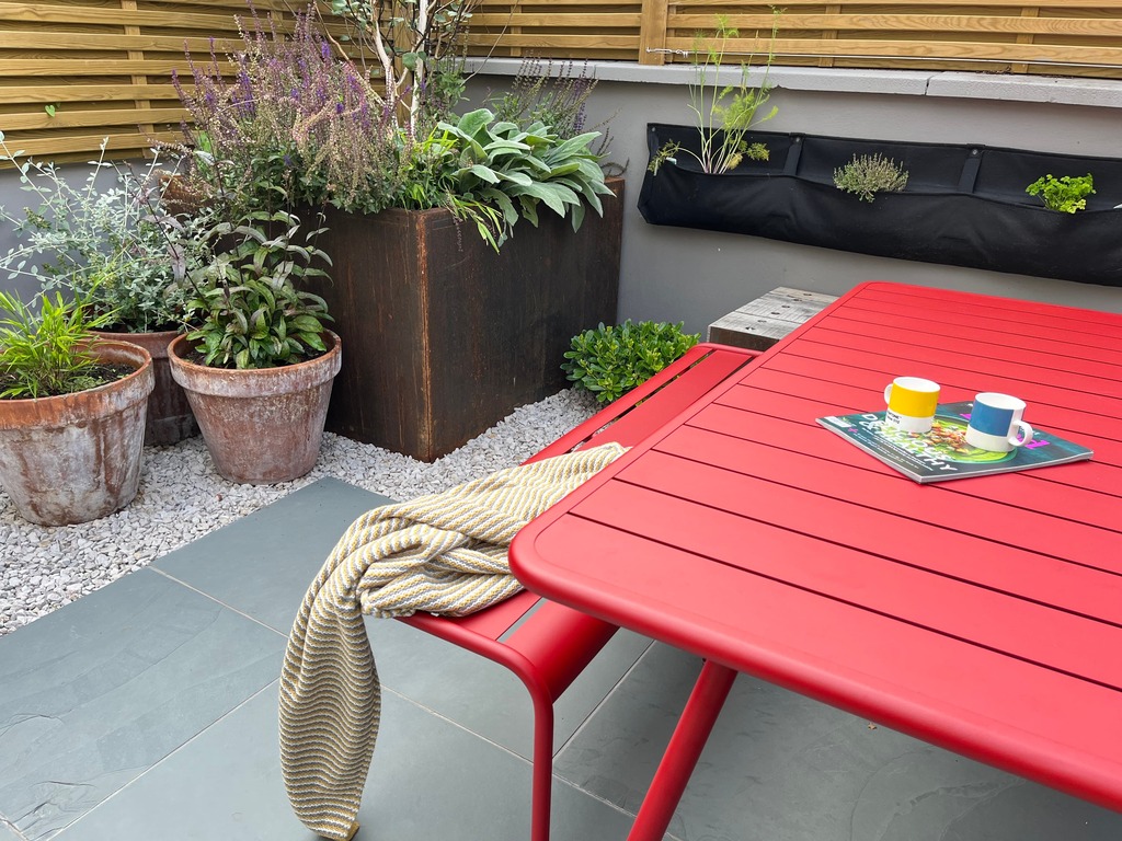 Outdoor table in Victorian terrace garden 