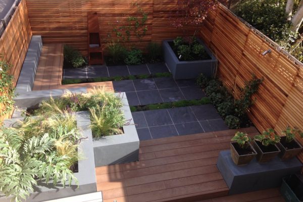 Shirehampton garden outdoor built-in benches, cedar fencing, slate paving and composite decking